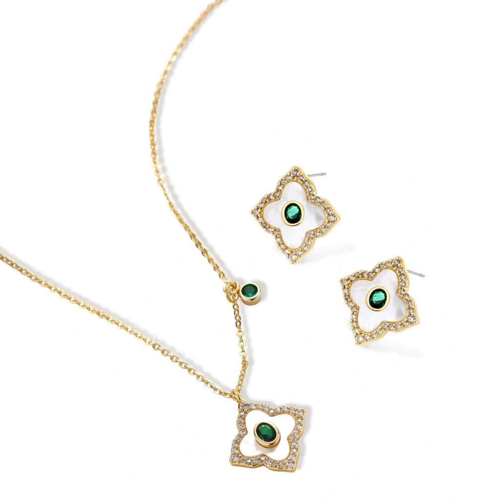 Gold-plated jewelry set with diamond-shaped pendants featuring white centers, green stones, and sparkling zirconia borders