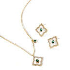 Gold-plated jewelry set with diamond-shaped pendants featuring white centers, green stones, and sparkling zirconia borders
