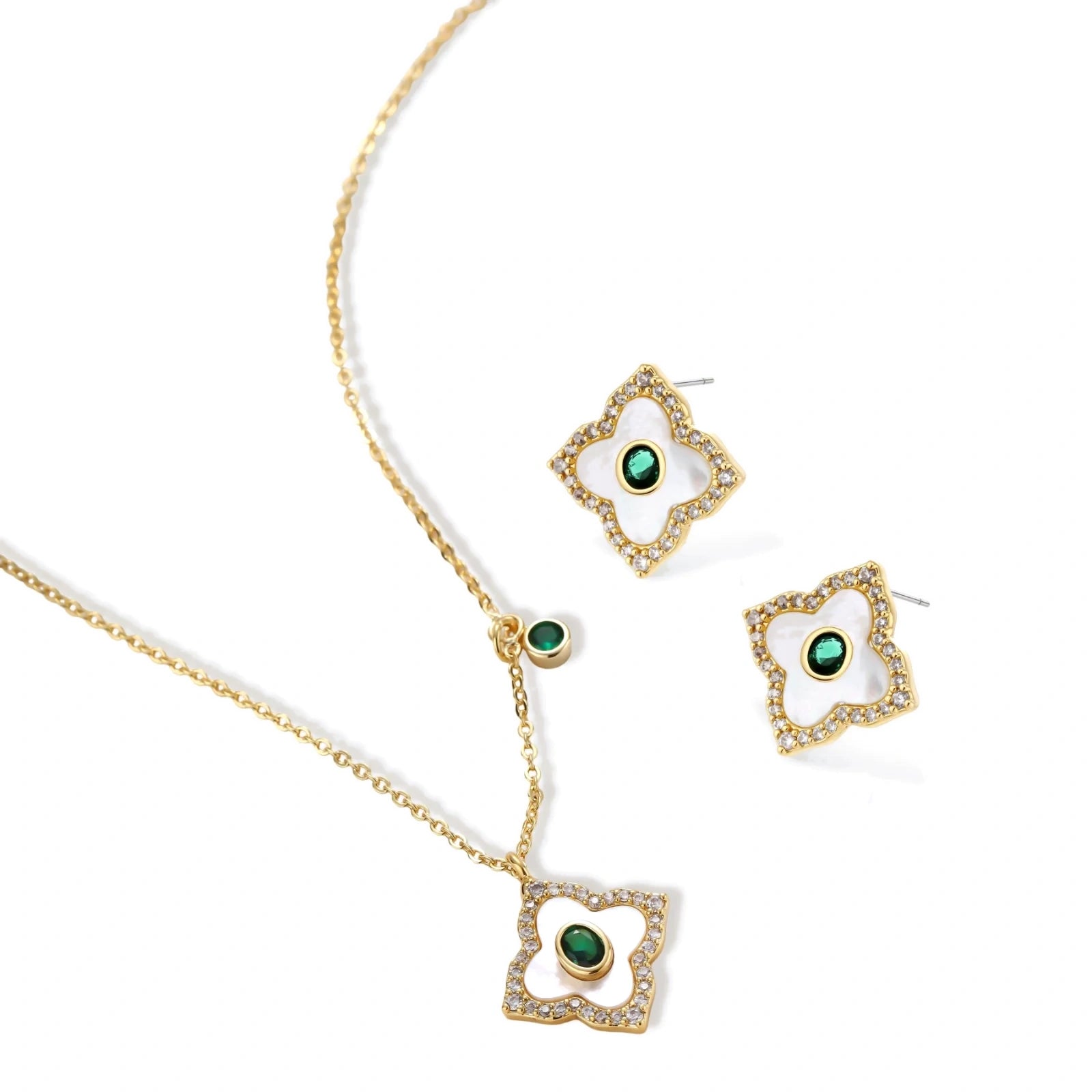 Gold-plated jewelry set with diamond-shaped pendants featuring white centers, green stones, and sparkling zirconia borders