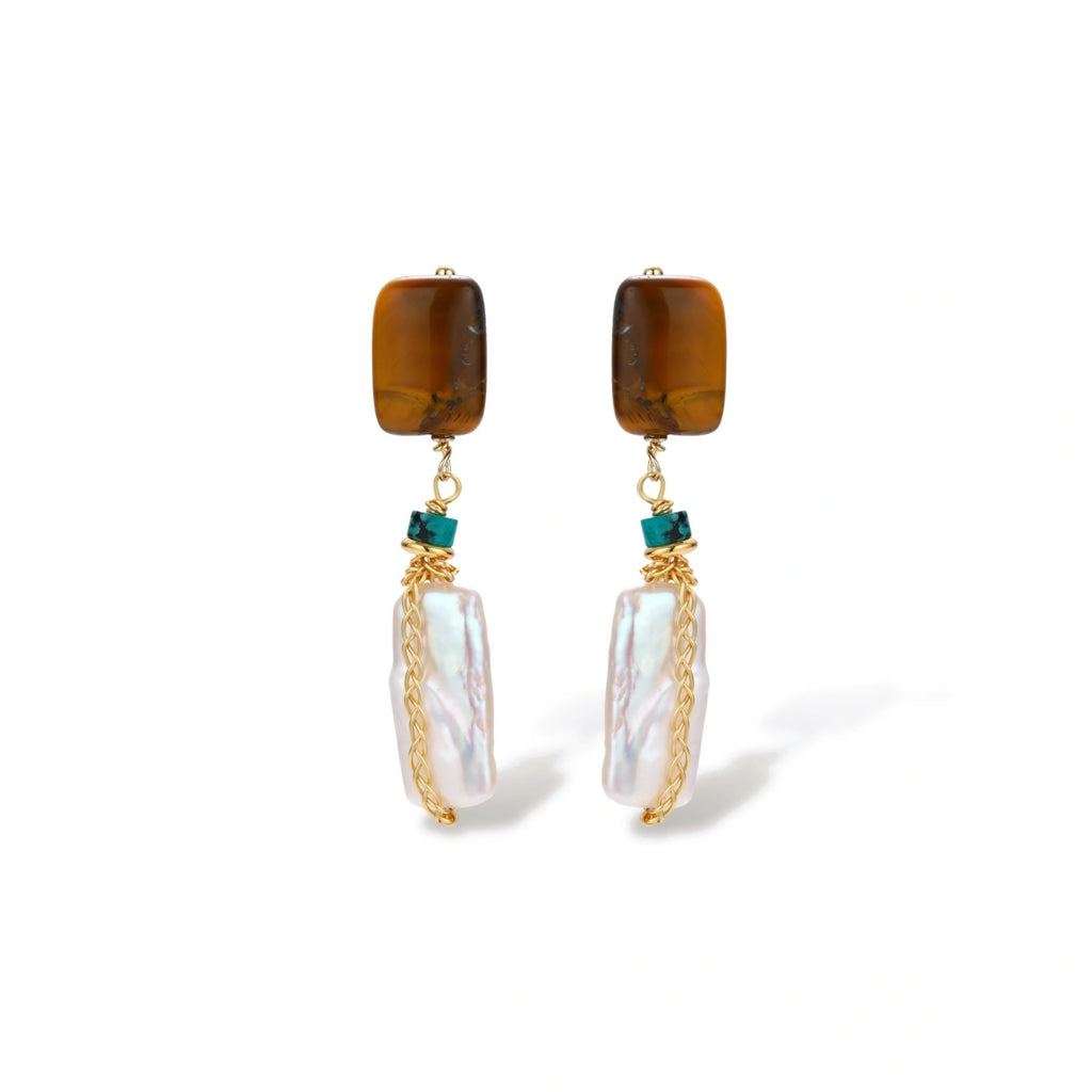 Gold-plated drop earrings with amber stones, teal beads, and wire-wrapped baroque pearls on cream background.