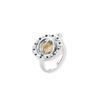 Adjustable brass ring with rotating zirconia center, surrounded by black enamel celestial stars and moon details