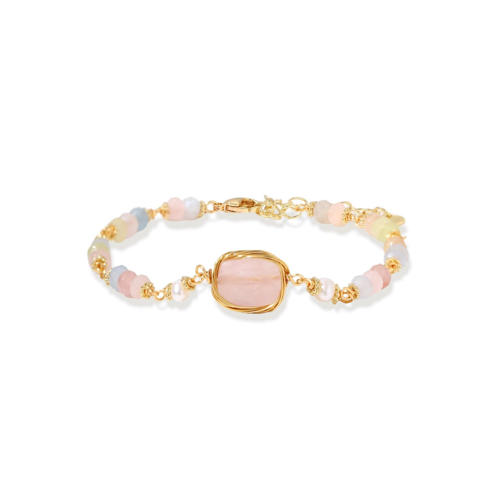 Delicate beaded bracelet with pastel rose quartz, pearls, and pink cushion-cut centerpiece in gold-plated setting