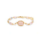 Delicate beaded bracelet with pastel rose quartz, pearls, and pink cushion-cut centerpiece in gold-plated setting