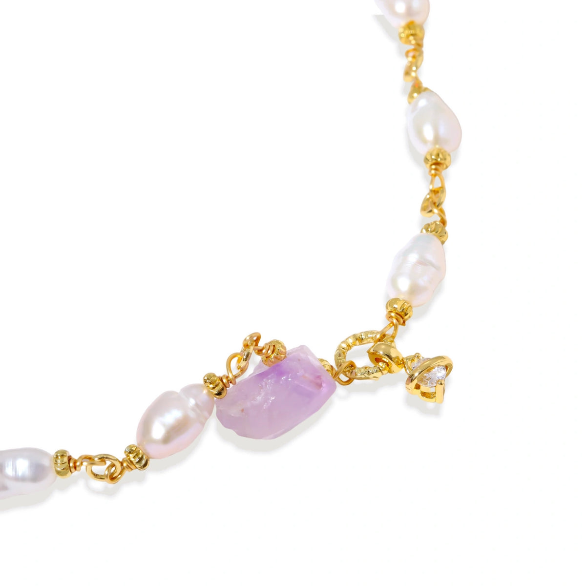 Gold-plated bracelet with lustrous baroque pearls and raw lavender amethyst centerpiece on white background.