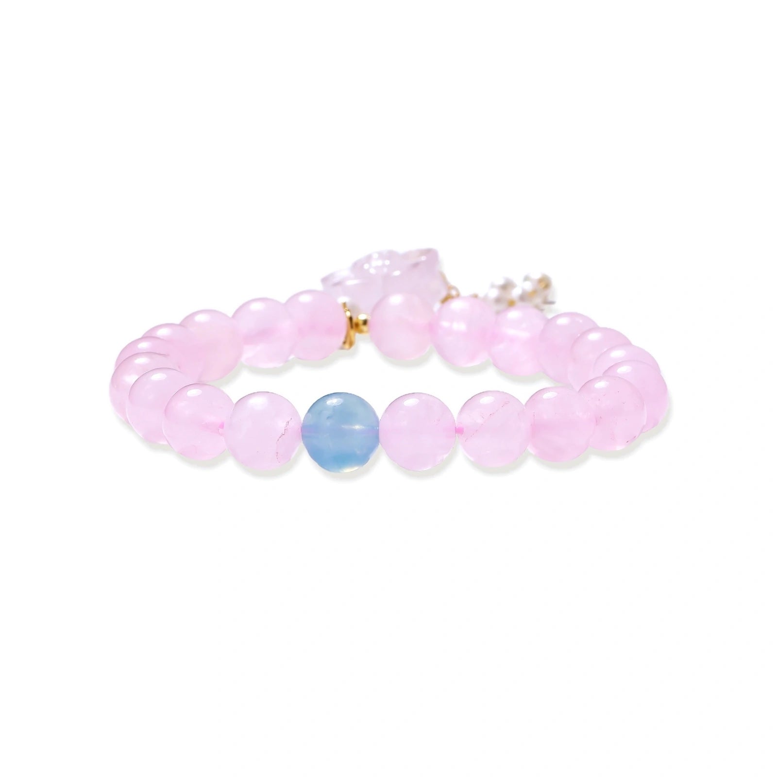 Stretchy beaded bracelet with pink rose quartz, blue aquamarine, carved floral pendant, and pearl tassel clasp.