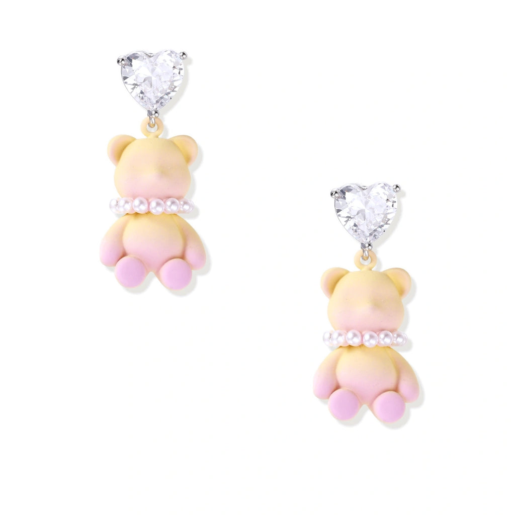 Pastel gradient teddy bear drop earrings with clear heart studs and pearl details on white background.