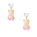 Pastel gradient teddy bear drop earrings with clear heart studs and pearl details on white background.