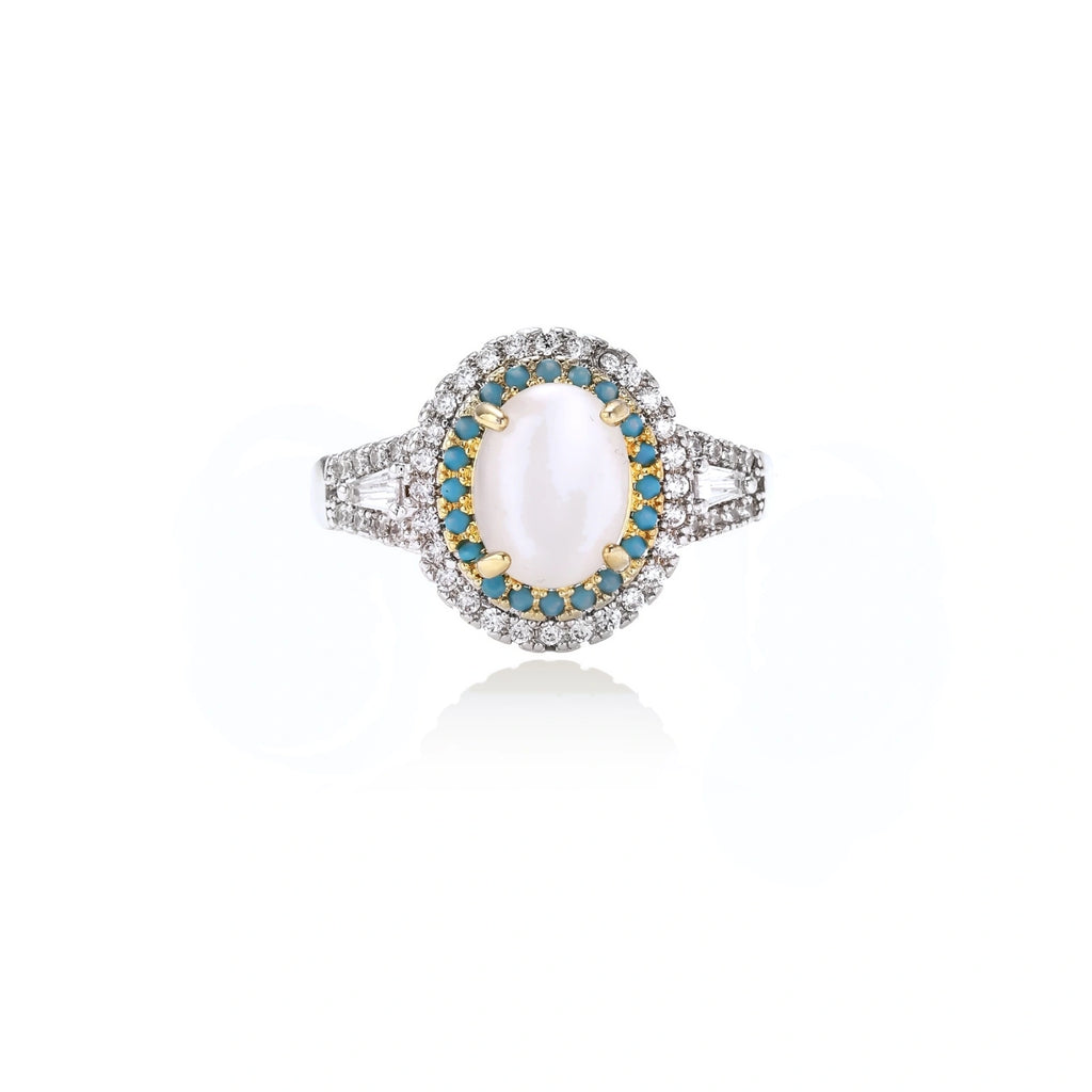 Vintage-style cocktail ring with luminous cat's eye center stone surrounded by turquoise and crystal double halo on white gold plated band