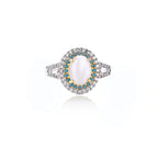 Vintage-style cocktail ring with luminous cat's eye center stone surrounded by turquoise and crystal double halo on white gold plated band