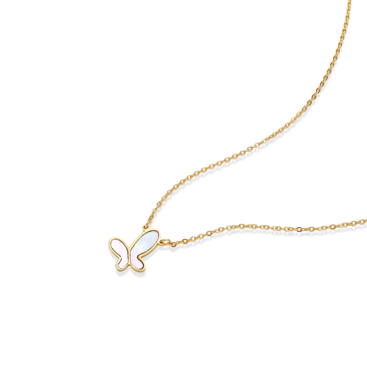 Gold-plated butterfly pendant with iridescent mother of pearl inlay on delicate chain against cream background.