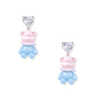 Cute pink teddy bear dangle earrings with clear crystal hearts and blue enamel details on white background.